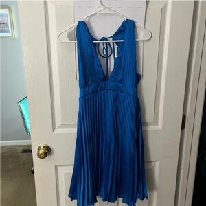 Blue dress- triangle cut. Not too short or revealing. Very soft. Runs big